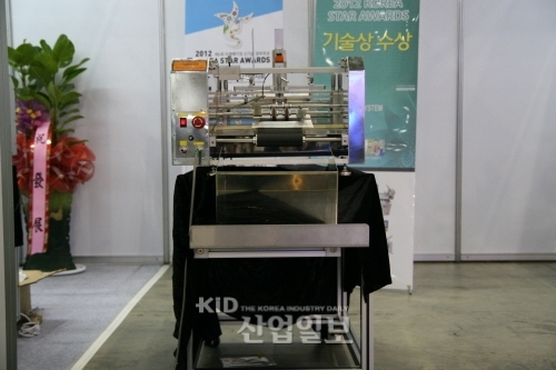 [2012 서울국제포장전 현장스케치] 코마스팩, 20년 노하우의 포장기 전문 업체